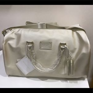 Brand new Michael Kors gold weekender duffel bag